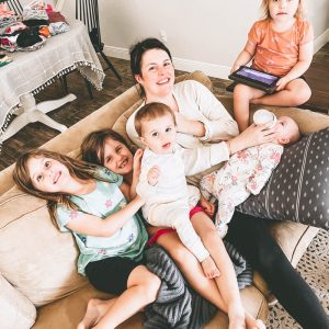 mom on couch with five kids